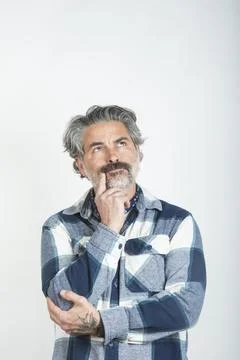 Man having a doubt or question on white background Stock Photos