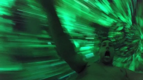 Man having fun and sliding down in a water slide Stock Footage 72495501