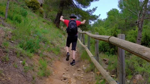 Man is having fun. Dancing and jumping. Hiking in nature. Stock Footage 189529727