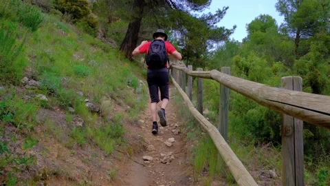 Man is having fun. Dancing and jumping. Hiking in nature. Stock Footage 214066100