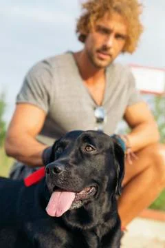 Man having fun with his dog. Stock Photos