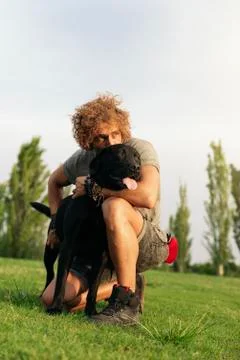 Man having fun with his dog. Stock Photos