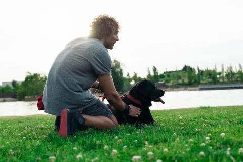 Man having fun with his dog. Stock Photos
