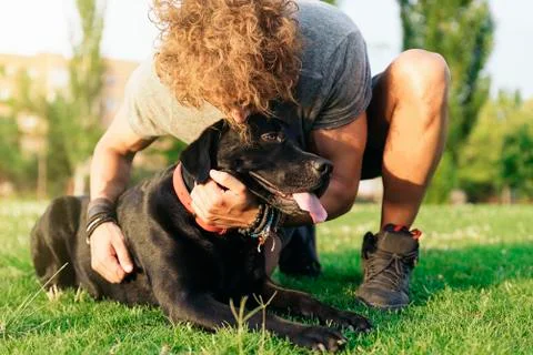 Man having fun with his dog. Stock Photos