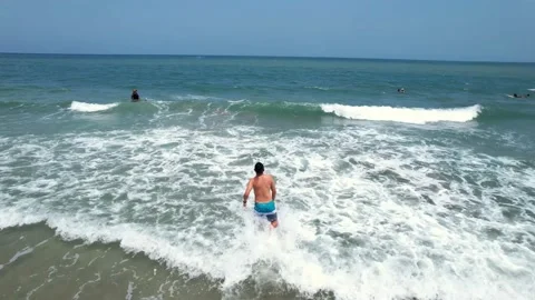 Man having fun in the sea, view from above Stock Footage 238870936