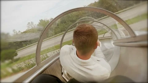 Man having fun sliding down on slide in slow motion. carefree happiness Vídeo Stock 42942398