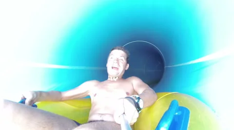 Man having fun, sliding at water park Stock Footage 64146746