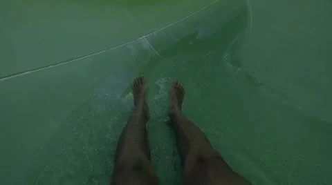 Man having fun, sliding at water park Stock-Footage 64148008