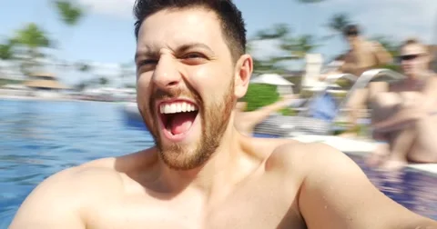 Man having fun on the swimming pool Stock Footage 58956898