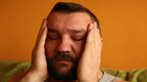 Man having a headache at home  Stock Footage 61302737