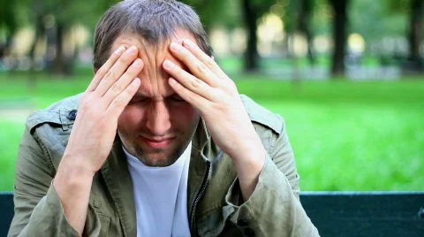 Man having headache, outdoors Stock Footage 858216