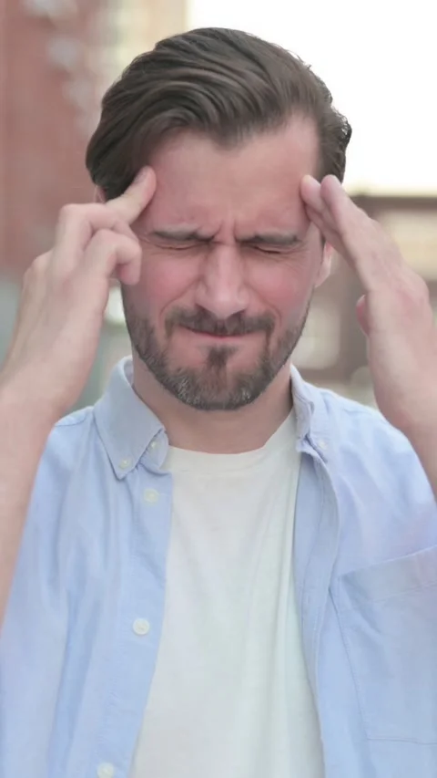 Man having Headache while Standing Outdoor, Vertical Video Video stock 339665546