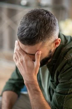 Man having headache while waiting for psychoanalyst Stock Photos