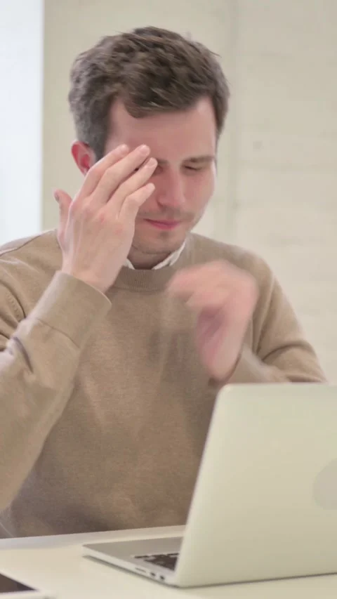 Man having Headache while Working on Laptop, Vertical Video Stock Footage 337351074