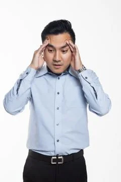 Man having headache at work Stock Photos