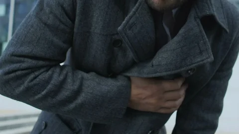 Man having heart attack in street, touching chest and suffering pain, health Stock Footage 117223075