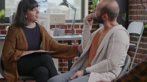 Man having nervous breakdown in front of woman at aa therapy meeting Stock Footage 165150880