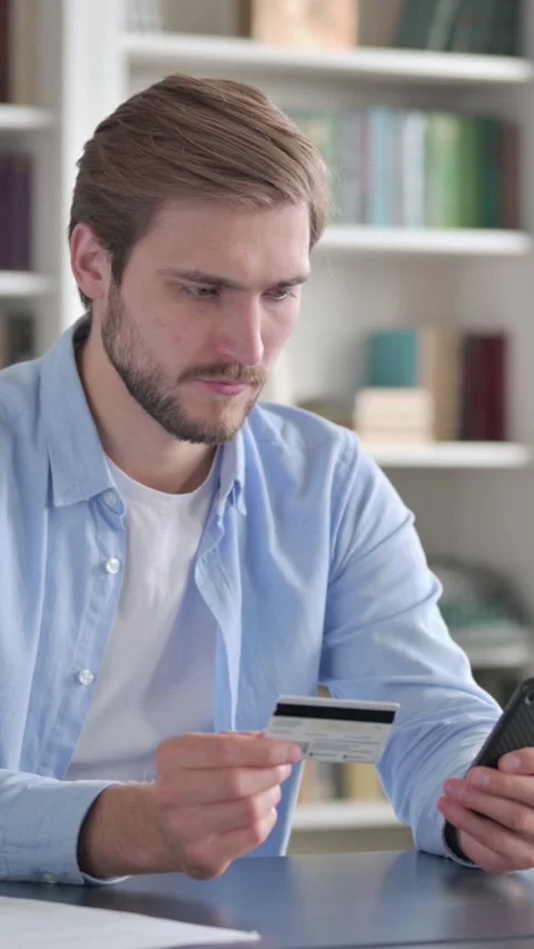 Man having Online Payment Failure on Smartphone, Vertical Video Stock Footage 339578741