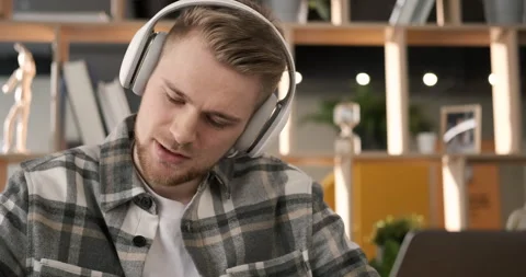 Man having online video chat conference. Portrait serious man in headphones. Video stock 151534225
