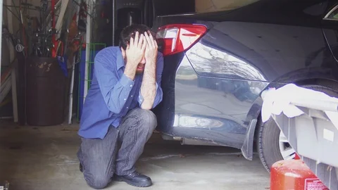 Man having panic attack in garage Stock Footage 106271022