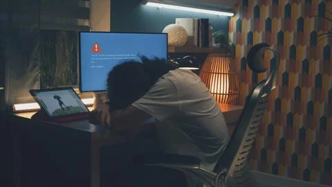 Man having problem with pc during work Stock Photos