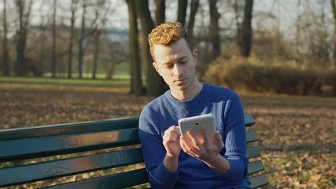 Man having problems with tablet and look irritated, steadycam shot Stock-Footage 70746965
