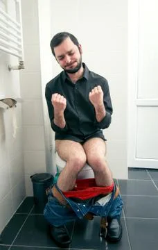 Man having problems in the toilet Stock-Fotos