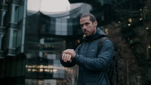 Man having quick looks at his watch with a worried expression Stock Footage 130981791