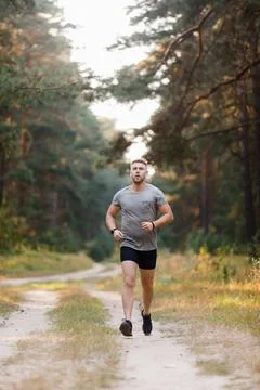 Man having run at forest Stock Photos