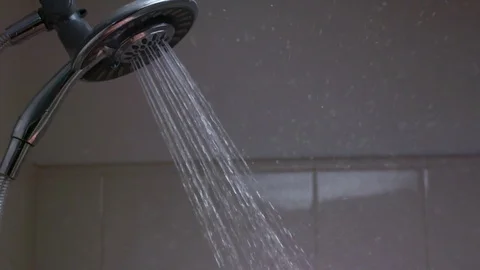 Man having showers in the bathroom Stock Footage 83188481