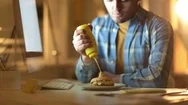 Man Having Snack At Work Table Stock Footage