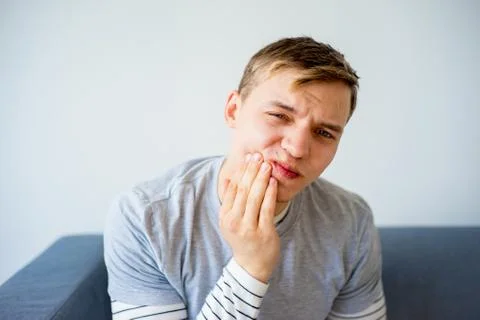 Man having a toothache Stock Photos