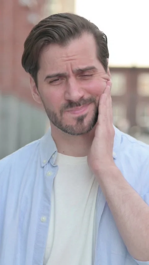 Man having Toothache while Standing Outdoor, Vertical Video Stock Footage 339665560