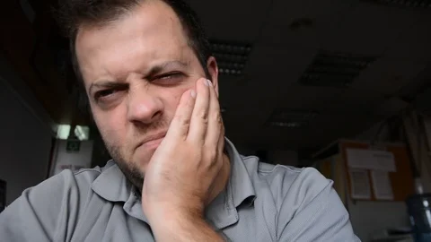 Man having toothache at workplace Stock-Footage 115529242
