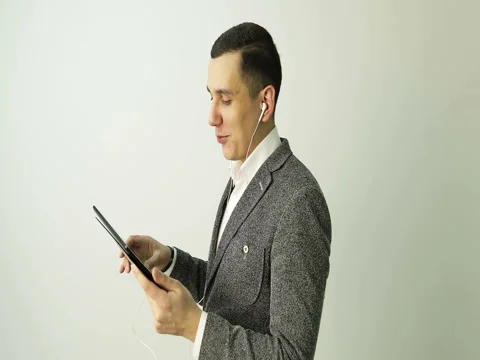 Man having video call with tablet and headphones. Stock Footage 73776739