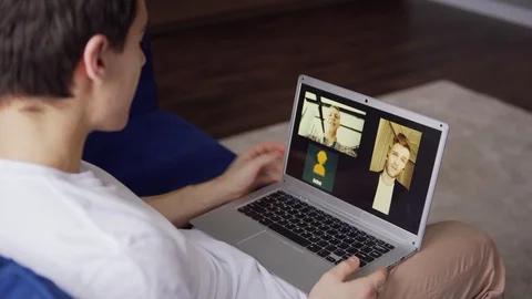 Man having video call with two colleagues from home Video stock 128758480