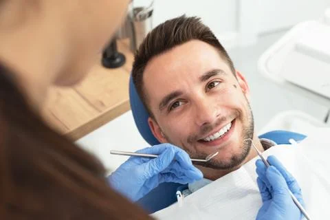 Man having a visit at the dentist's 스톡 사진