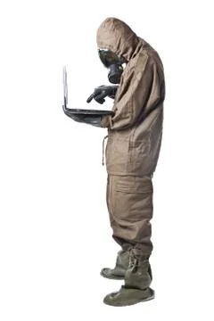Man in hazard suit using a laptop Stock Photos