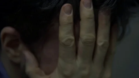 Man With Head In Hands, Stressed And Anxious Pulling Hair Stock Footage 100902434