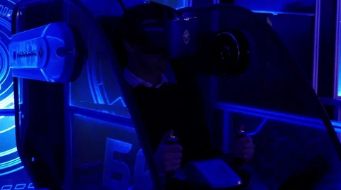 Man in head-mounted display turning his head and waiting for virtual game Stockbeeldmateriaal 67250710