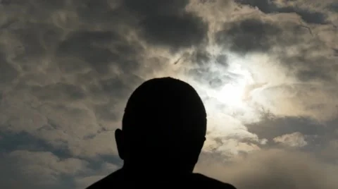 Man head silhouette with fast moving clouds time lapse Stock Footage 48852895