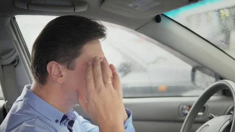 A man is a headache in a car. Stock Footage 81820029