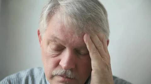 Man with a headache Stock Footage 9795006