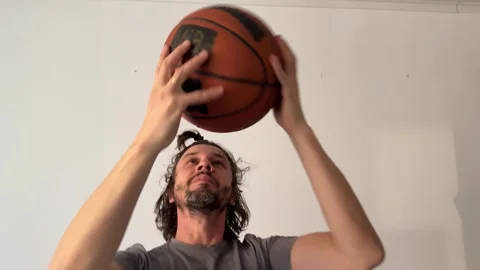 Man heading a ball with head, sport action and coordination concept, dynamic Stock Footage 337109883