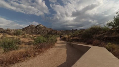 Man Heading Up The Toms Thumb Desert Hiking Trail In Scottsdale Arizona Stock Footage 339594551