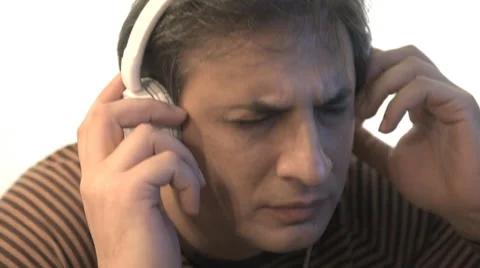Man with a headphones on listening to the music. Stock-Footage 59162272