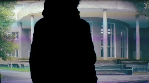 The man in the headphones looks like the letters float on the screen Stock Footage 104260210
