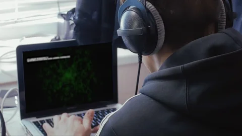 Man in headphones with program code Stock Footage 106489526