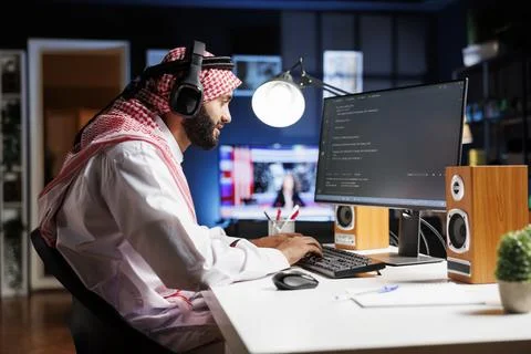 Man with headphones writing code Stock Photos