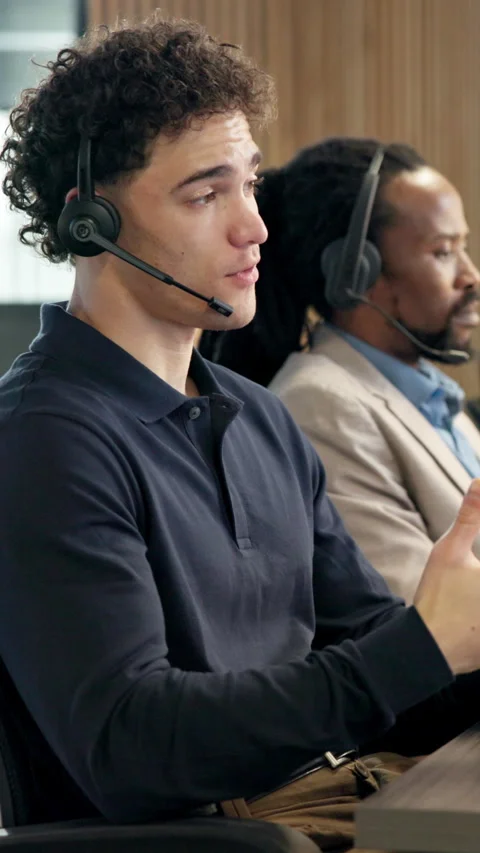 Man, headset and discussion in call center for help, customer support and Stock Footage 343323616